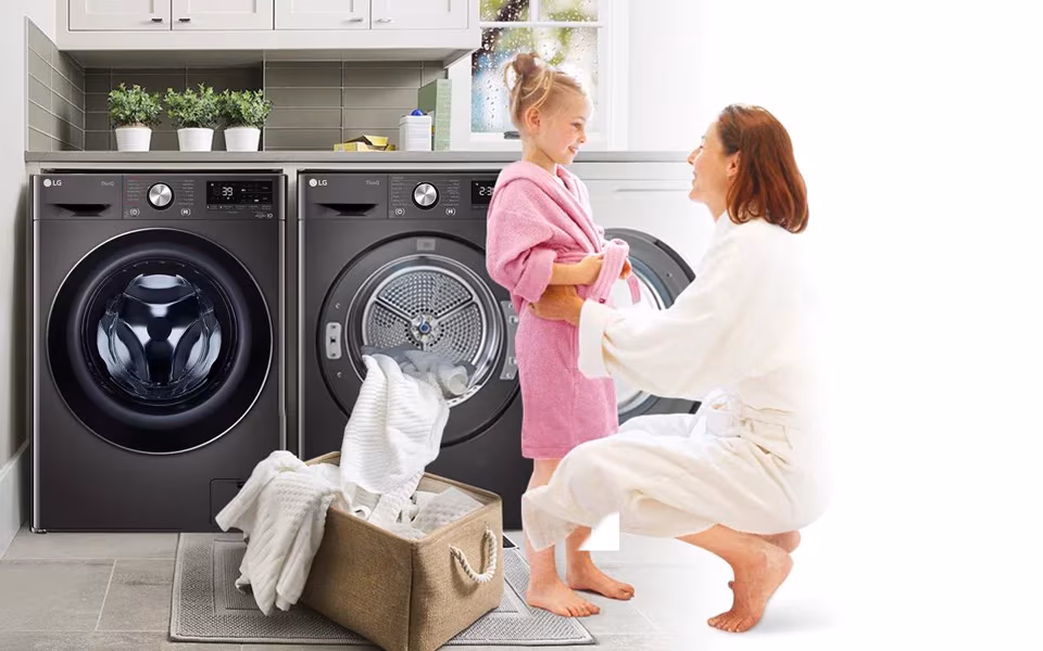 A modern white clothes dryer in a laundry room